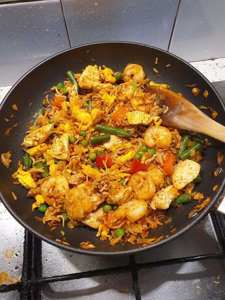Fried Rice De Luxe in a frypan on a stove